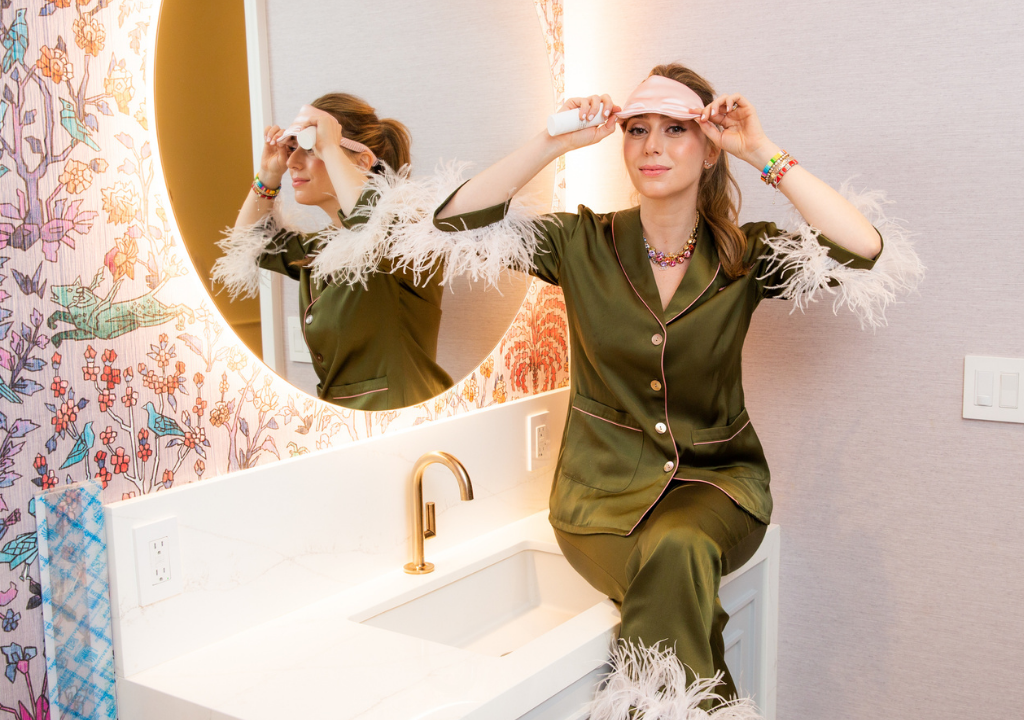 Founder Dr. Shereene Idriss in stylish pajamas in front of a vanity attached to article explaining her successful Instagram series One-Night Stand