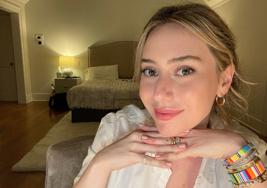 Dermatologist Dr. Shereene Idriss smiling indoors as she covers her journey with melasma and provides tips on how to get rid of it