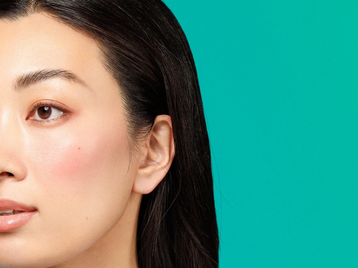 Profile of a woman with rosy cheeks, providing tips to reduce redness and rosacea