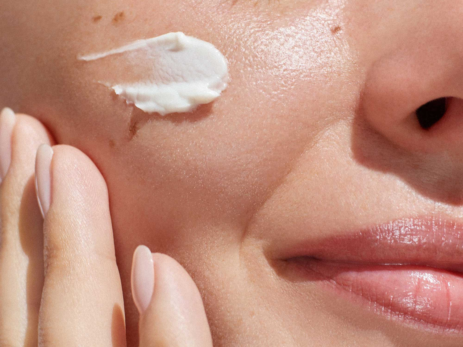 Close-up of cream applied to skin, showcasing dermatologist hacks to repair dry, inflamed skin barriers