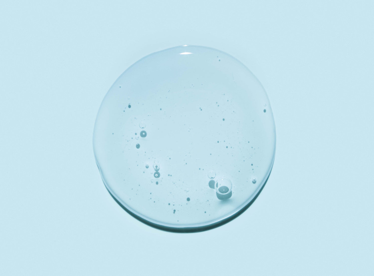 Drop of hexapeptide-2 against a blue background