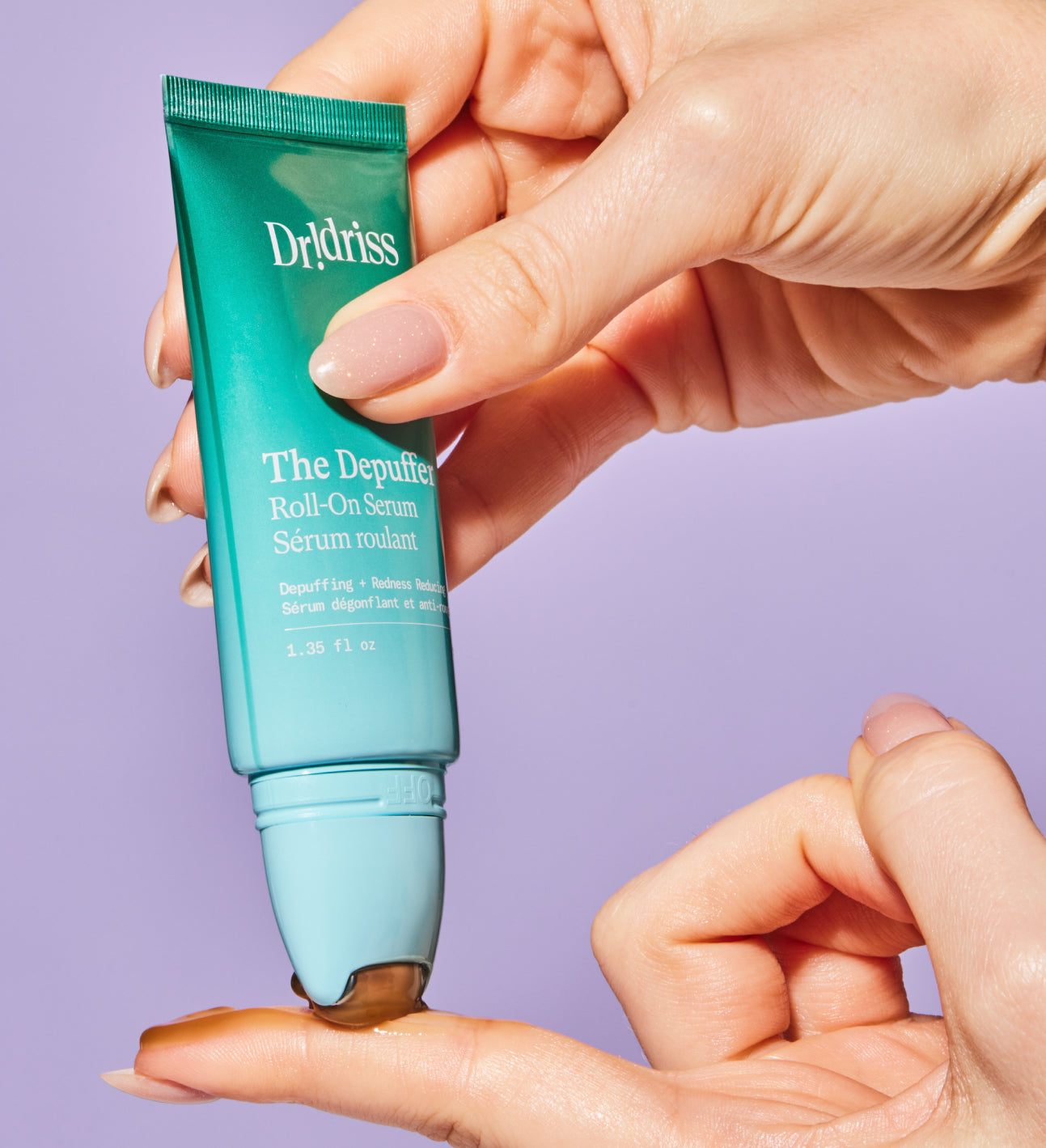 a photo dispensing the Depuffer serum on a finger