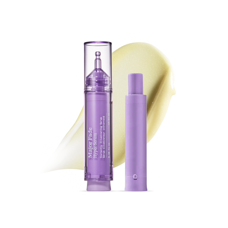 Major Fade Hyper Serum brightening treatment pen with illuminating serum texture smear on black background