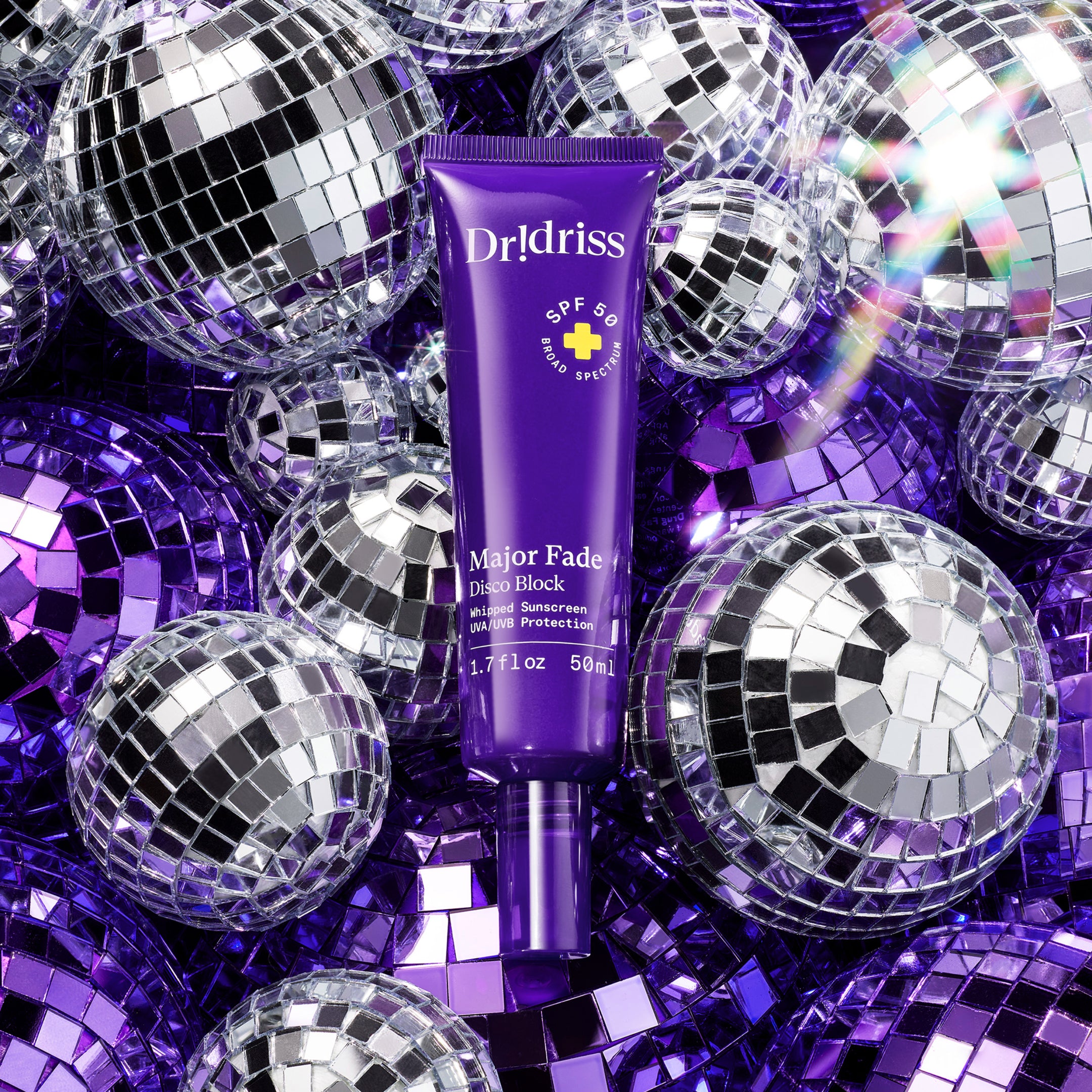 Major Fade Disco Block SPF 50 surrounded by mini disco balls