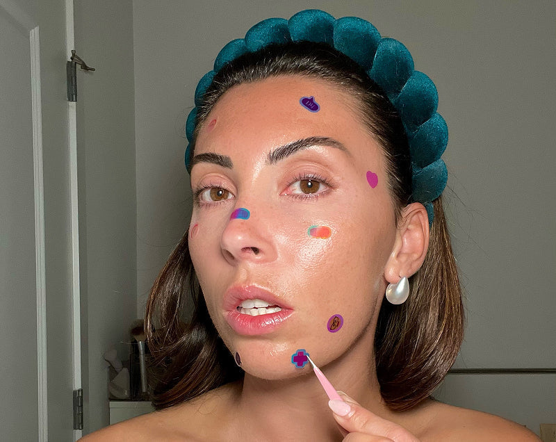 Woman applying the Pimple Patches