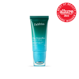 A close-up of Dr. Idriss The Depuffer Roll-On Serum in its teal green tube, with an "Allure Best of Beauty 2023 Award" badge displayed