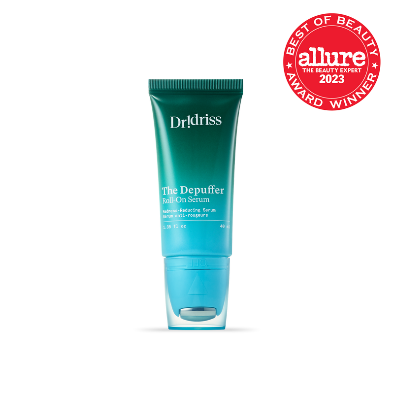 A close-up of Dr. Idriss The Depuffer Roll-On Serum in its teal green tube, with an "Allure Best of Beauty 2023 Award" badge displayed