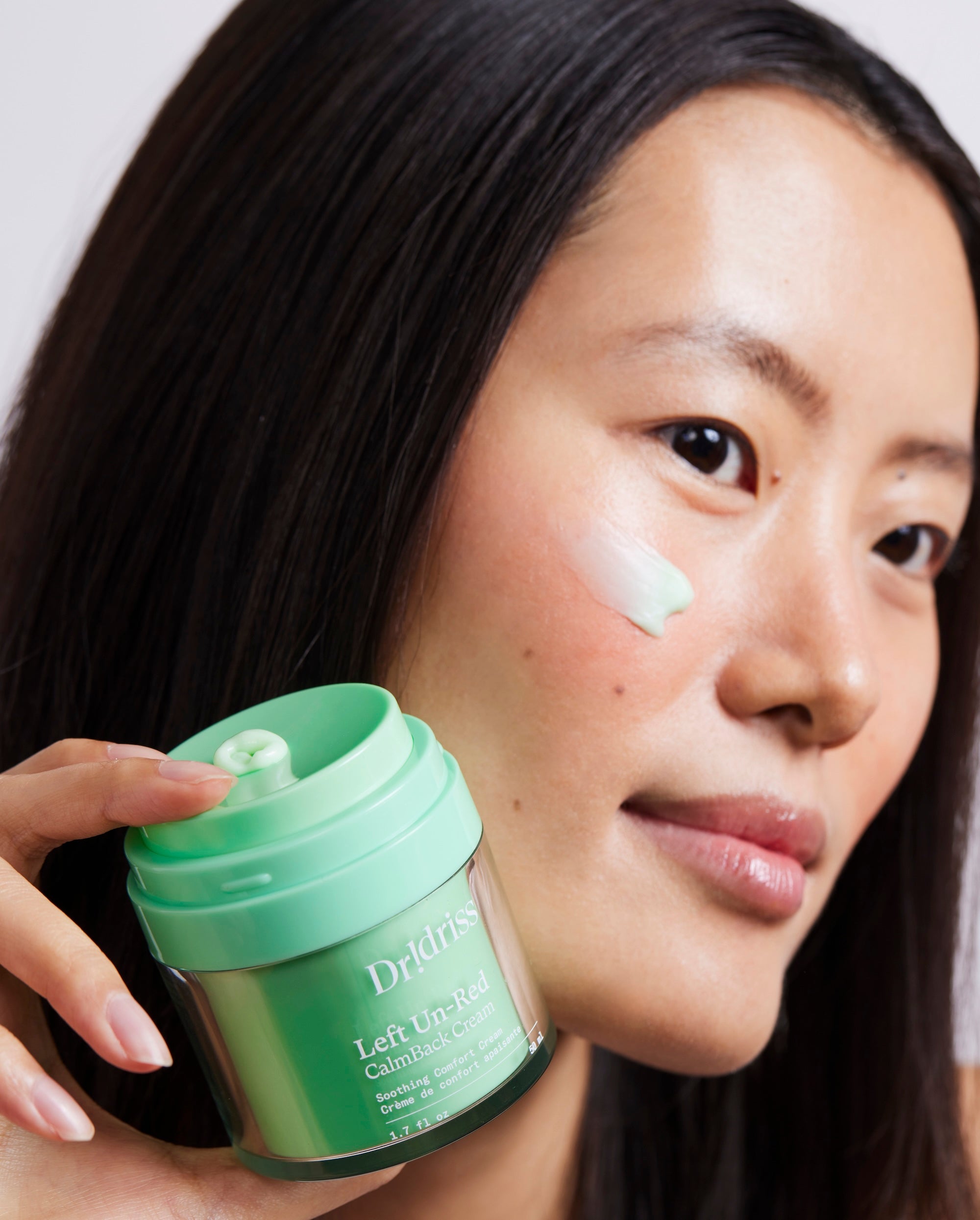 model wearing Left Un-Red calmback cream