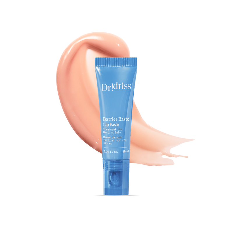 Barrier Baste Lip Baste treatment balm tube with glossy peach balm texture smear.