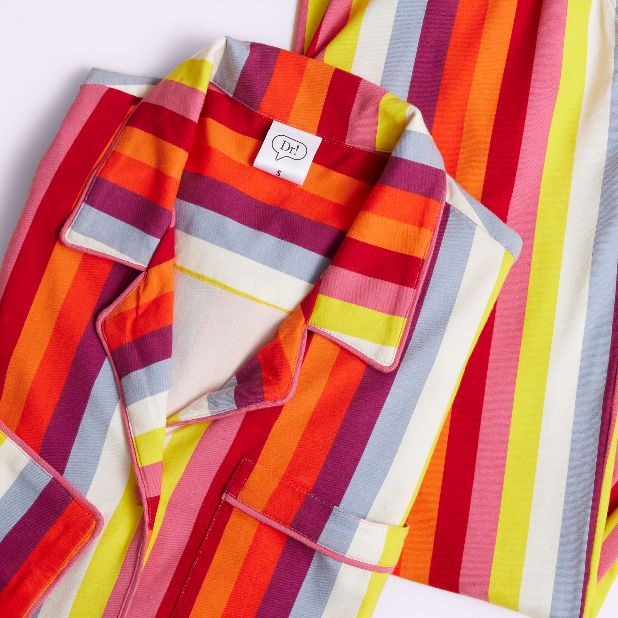 limited-edition PillowFightDerm PJs in rainbow striped pattern