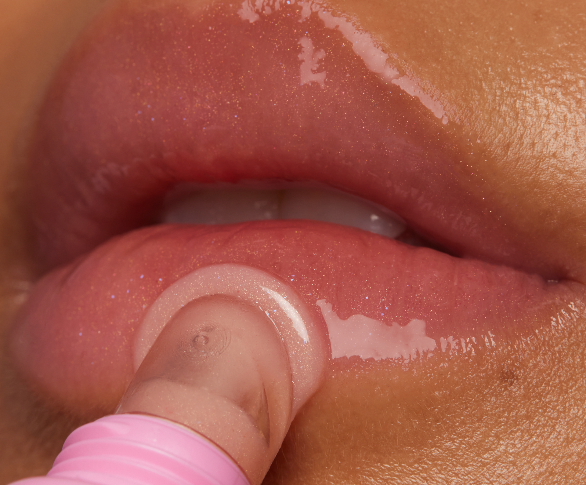 Barrier Baste Lip Baste Dessert applied to lips with shimmery pink finish